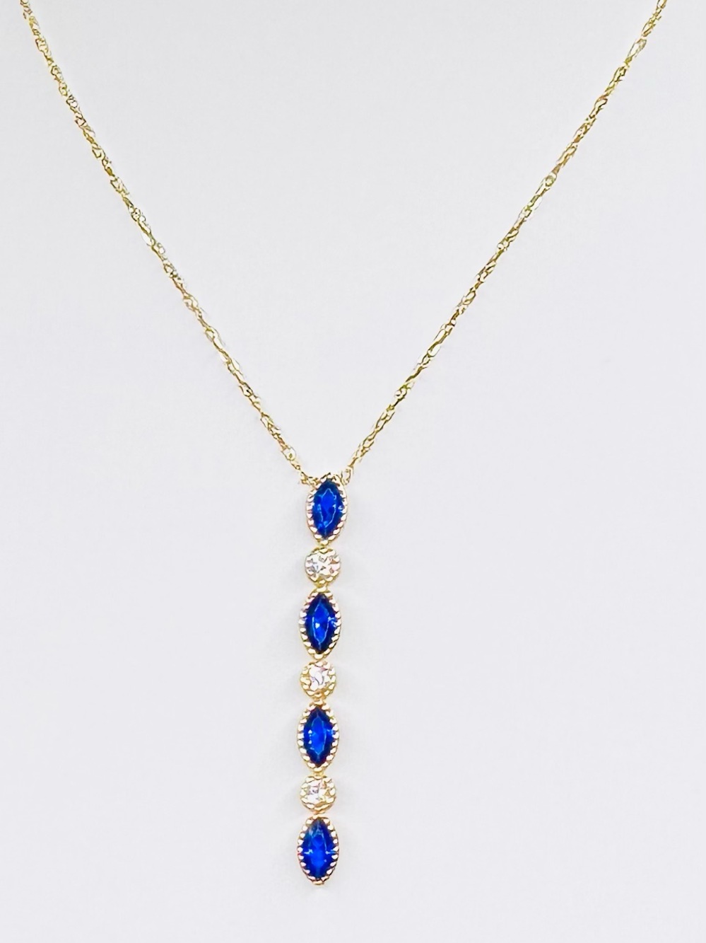 18K Gold Necklace with Blue Marquise Stones and Clear Accents